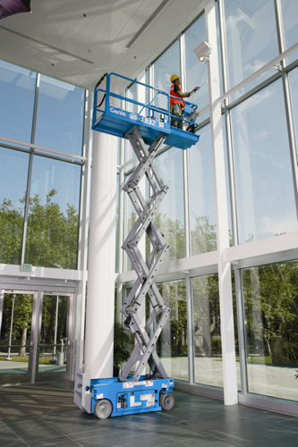 Genie GS1932 6m Scissor Lift fully extended indoors in use