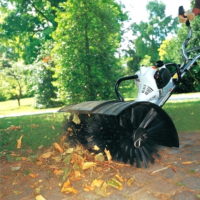 Stihl MM56 Powerbrush on hire clearing paths of leaves